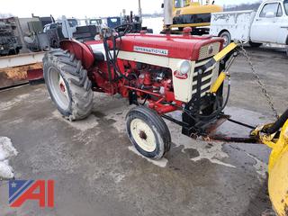 1959 International 340 Utility Tractor with Plow